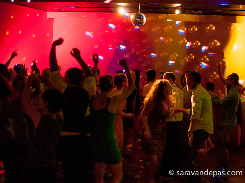 Dancefloor with disco ball and people dancing