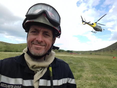 Romain suits up for a helicopter ride to fight wildfire.